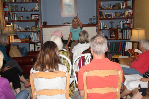 Candia talking to our group in my packed living room.